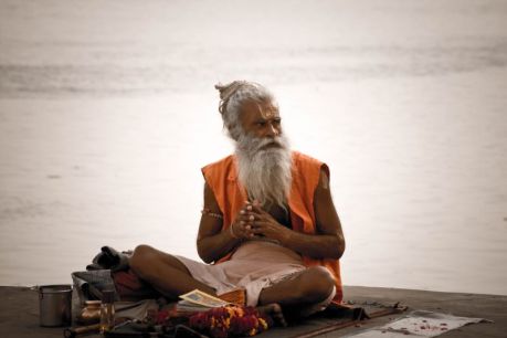 a_sadhu_by_the_ghats_on_the_ganges_varanasi